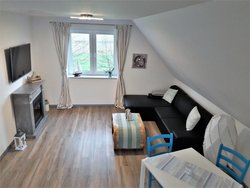 1. Bild zum Ferienhaus Haus "Heide und Meer" Wohn. 2.