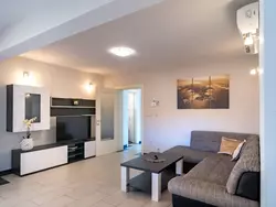 Bild zur gratis inserierten Ferienwohnung Appartement mit Blick auf das Wasser.