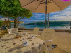 Bild zur gratis inserierten Ferienwohnung Wohnung "Punta Blue" mit Blick auf das Wasser.