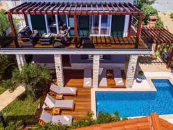 Bild zur gratis inserierten Ferienwohnung Haus in Stanići mit grünem Garten.