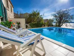 Bild zur gratis inserierten Ferienwohnung Maja mit Pool und herrlichem Meerblick.