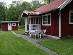 1. Bild zum Ferienhaus Gemütliches Holzhaus mit Boot.